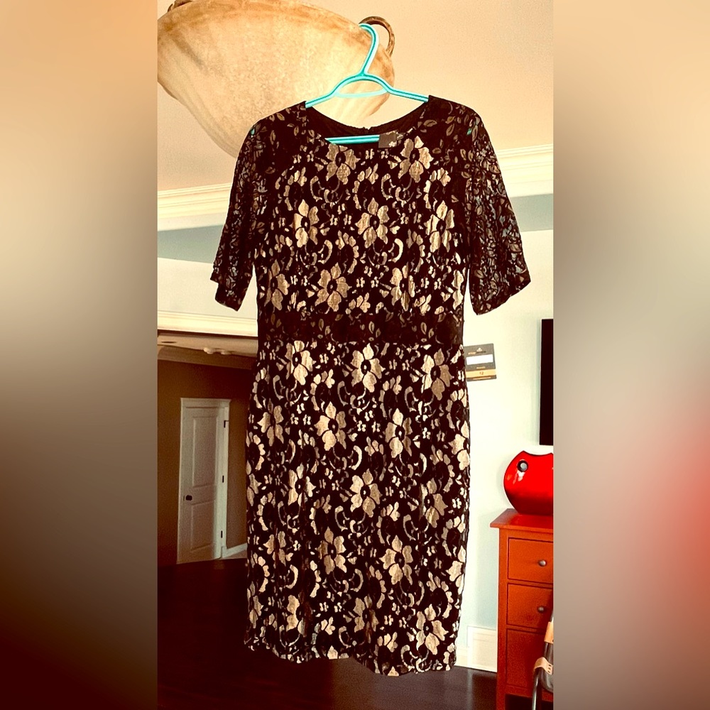 NWT. Cocktail dress black and gold lace overlay. Size 12 midi length. Classic.
